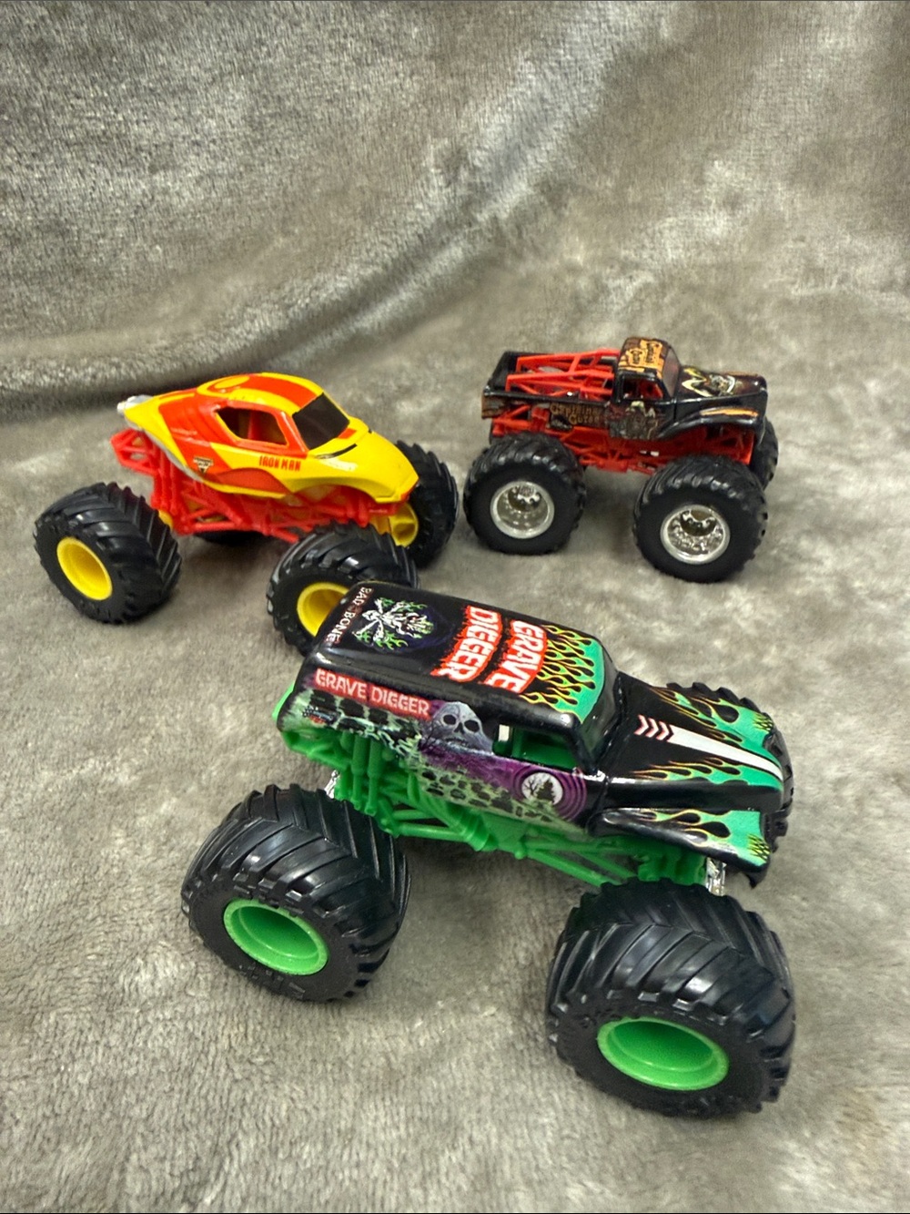 Lot of 3 Monster Trucks Iron Man, Grave Digger, & Captain’s Curse G